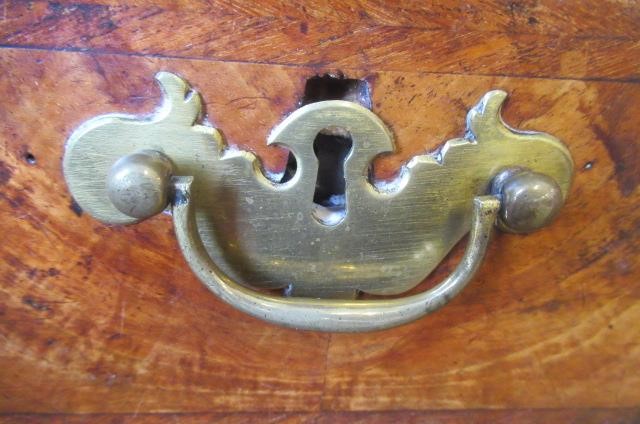 A WALNUT AND FEATHER BANDED STRAIGHT FRONTED CHEST Image
