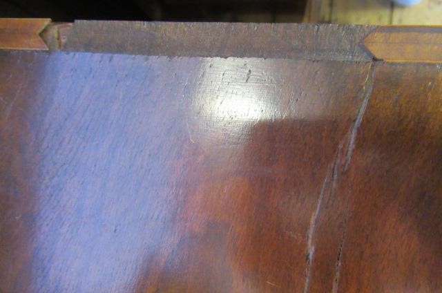 A WALNUT AND FEATHER BANDED STRAIGHT FRONTED CHEST Image