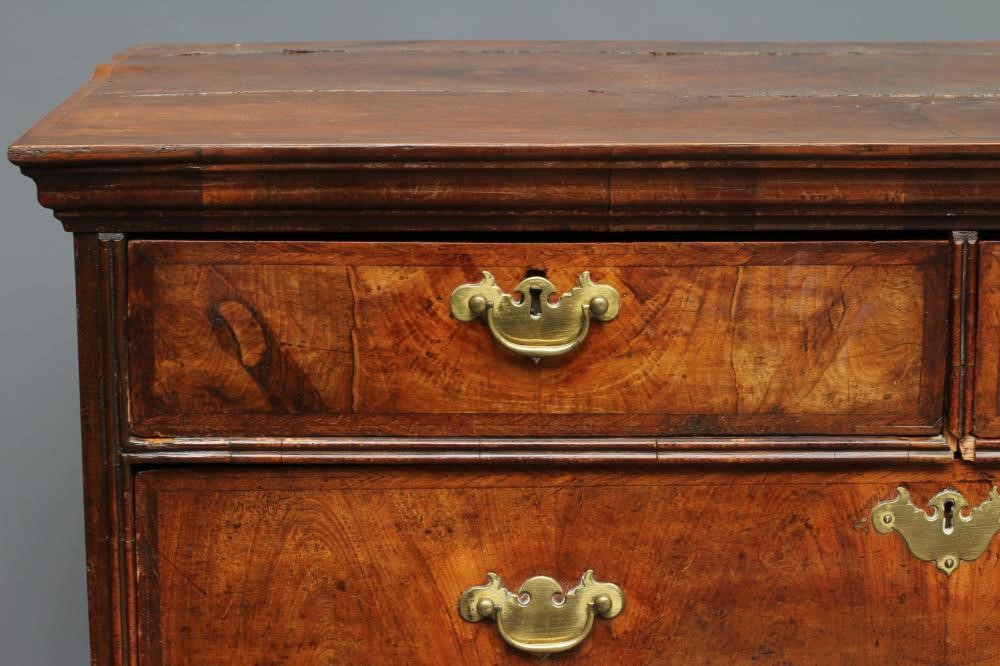 A WALNUT AND FEATHER BANDED STRAIGHT FRONTED CHEST Image