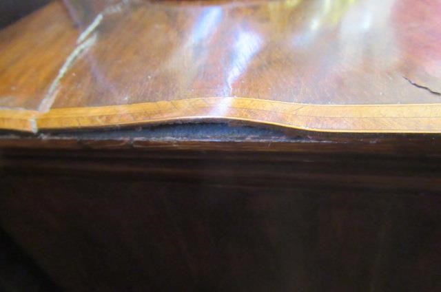 A WALNUT AND FEATHER BANDED STRAIGHT FRONTED CHEST Image