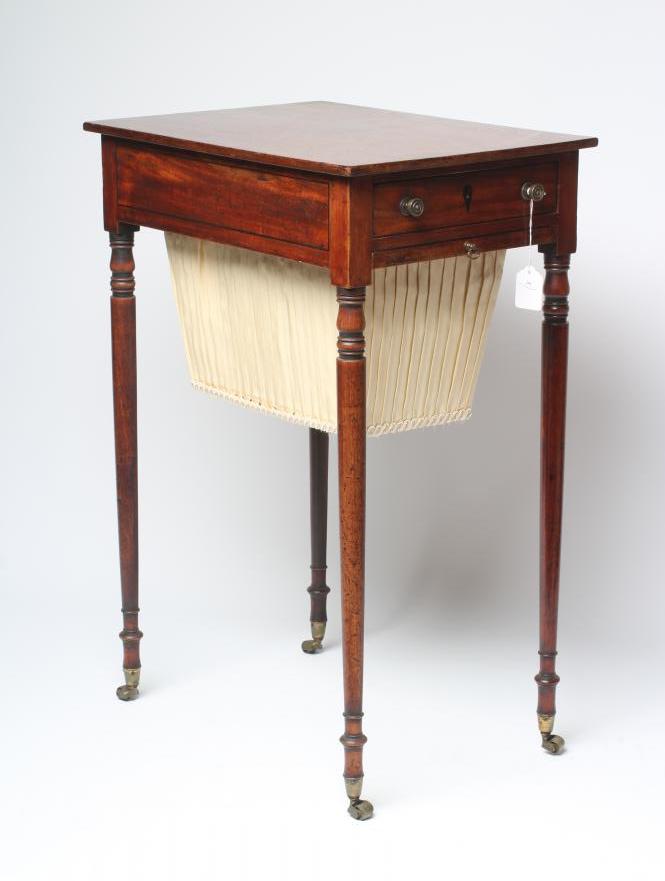 A REGENCY MAHOGANY WORK TABLE of oblong form with ebony stringing Image