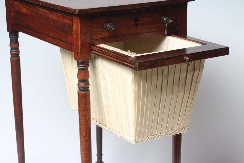 A REGENCY MAHOGANY WORK TABLE of oblong form with ebony stringing Image