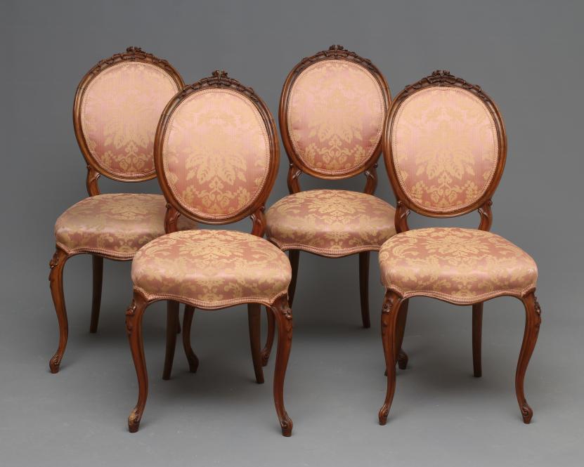 A SET OF FOUR EARLY VICTORIAN WALNUT DINING CHAIRS upholstered in pale pink silk damask Image