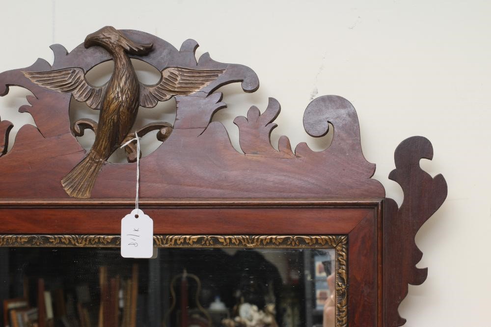 A MAHOGANY FRET FRAMED MIRROR Image