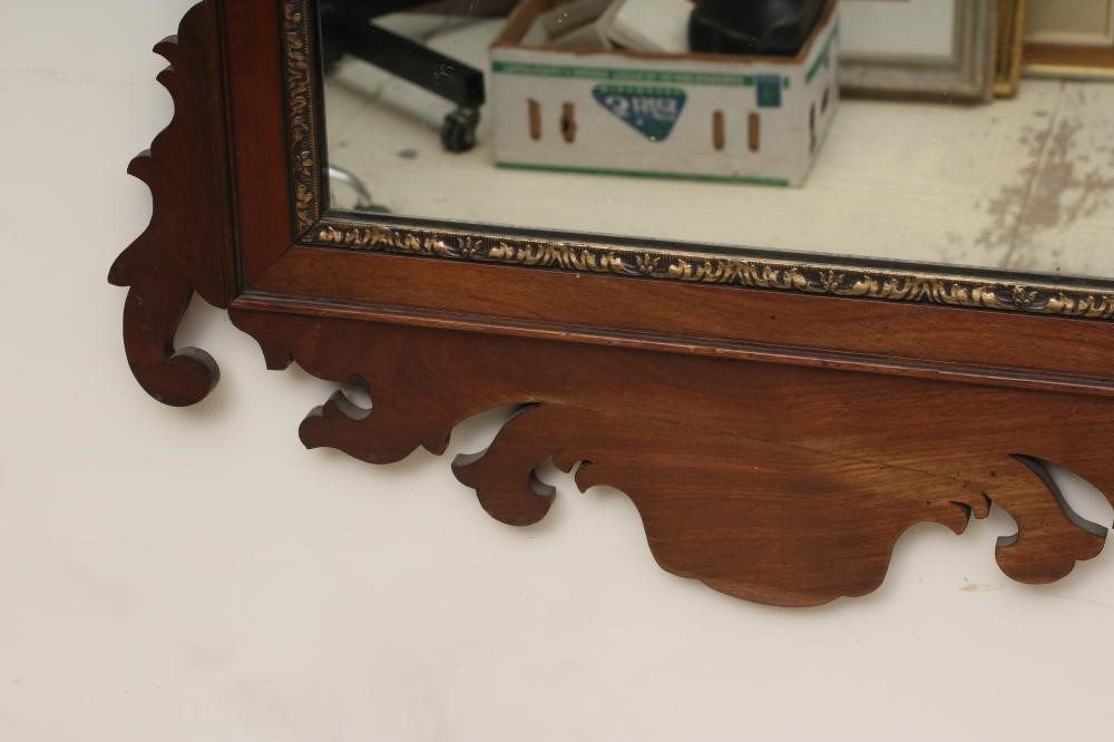 A MAHOGANY FRET FRAMED MIRROR Image