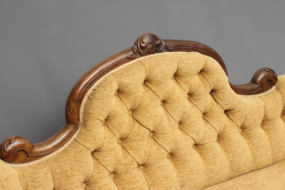 A VICTORIAN WALNUT SHOW FRAMED SOFA of serpentine form with rounded ends Image
