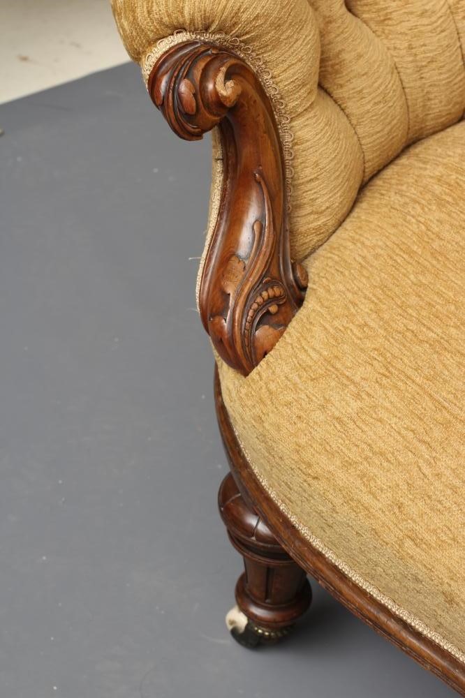 A VICTORIAN WALNUT SHOW FRAMED SOFA of serpentine form with rounded ends Image