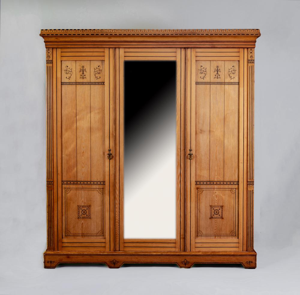 A VICTORIAN AESTHETIC ASH TRIPLE WARDROBE with black painted foliate scrolls and geometric banding Image