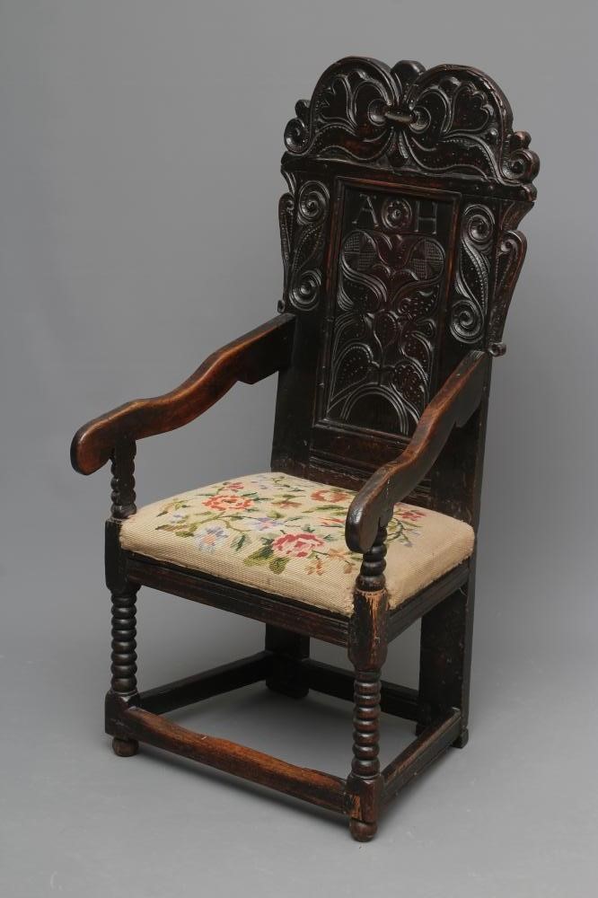 A JOINED OAK ARMCHAIR Image