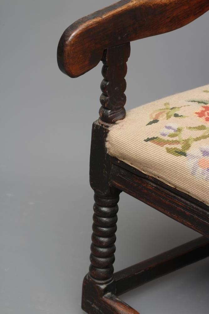 A JOINED OAK ARMCHAIR Image