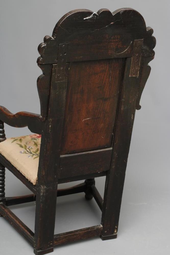 A JOINED OAK ARMCHAIR Image