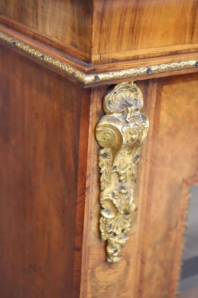 A VICTORIAN AND WALNUT MARQUETRY SIDE CABINET of oblong form crossbanded with gilt metal mounts Image
