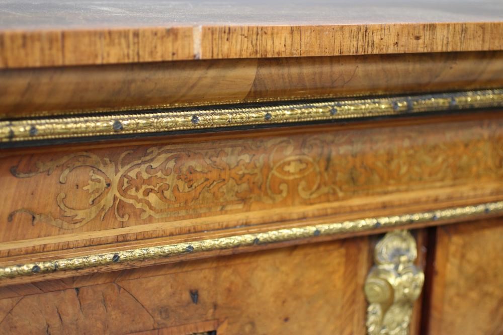 A VICTORIAN AND WALNUT MARQUETRY SIDE CABINET of oblong form crossbanded with gilt metal mounts Image