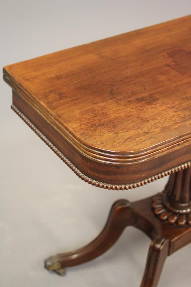 A REGENCY MAHOGANY FOLDING TEA TABLE of rounded oblong form Image