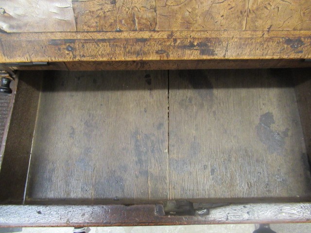 A WALNUT AND FEATHER BANDED BUREAU Image