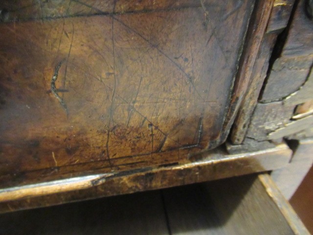 A WALNUT AND FEATHER BANDED BUREAU Image