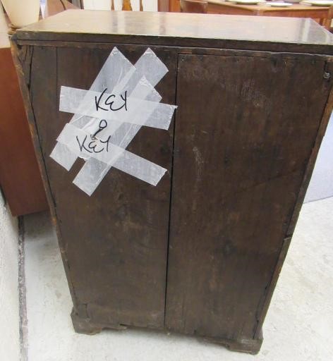 A WALNUT AND FEATHER BANDED BUREAU Image