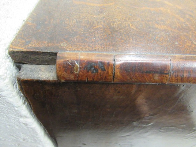 A WALNUT AND FEATHER BANDED BUREAU Image