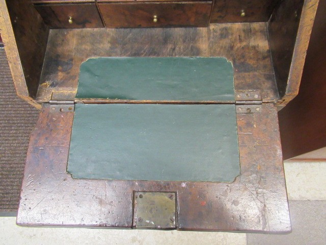 A WALNUT AND FEATHER BANDED BUREAU Image