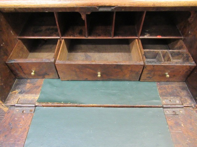A WALNUT AND FEATHER BANDED BUREAU Image