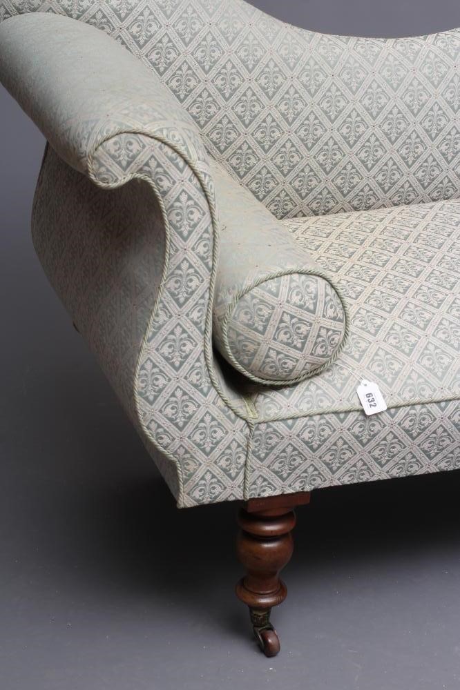 A VICTORIAN WALNUT FRAMED CHAISE LONGUE upholstered in a pale green trellis pattern weave Image