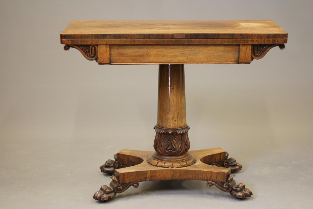 A LATE GEORGIAN ROSEWOOD FOLDING CARD TABLE of rounded oblong form Image