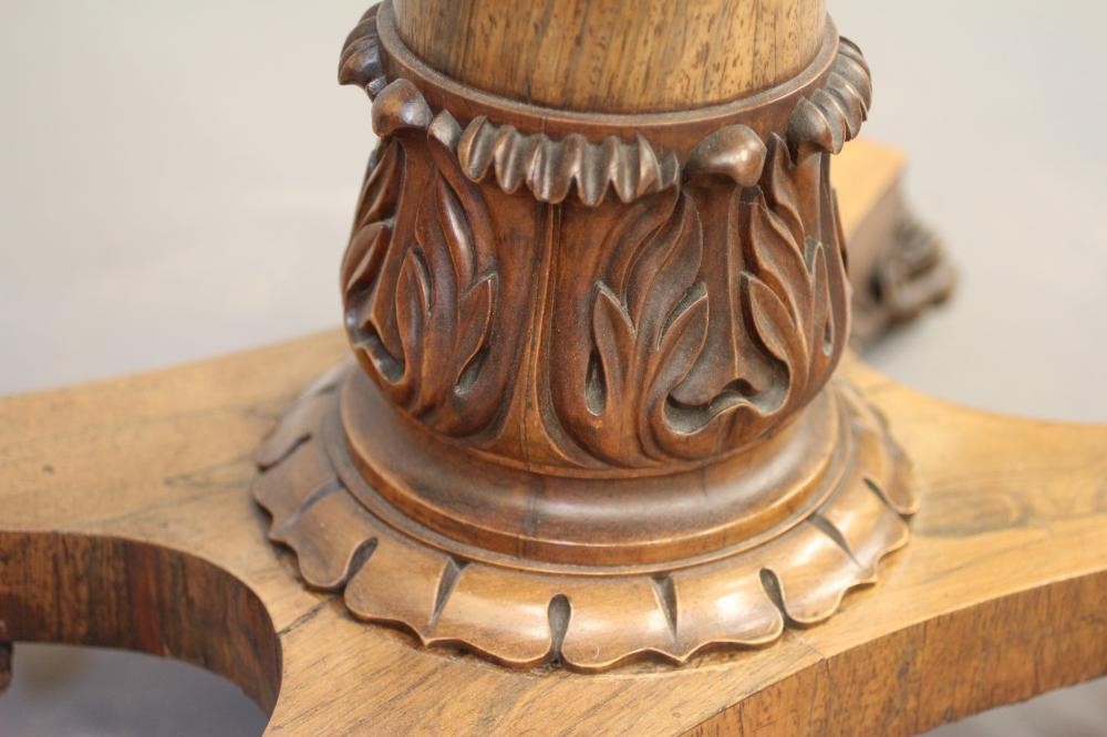 A LATE GEORGIAN ROSEWOOD FOLDING CARD TABLE of rounded oblong form Image