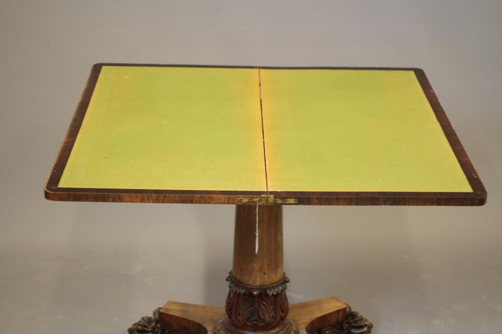 A LATE GEORGIAN ROSEWOOD FOLDING CARD TABLE of rounded oblong form Image