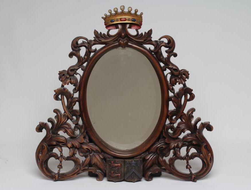 A MAHOGANY FRAMED WALL MIRROR Image