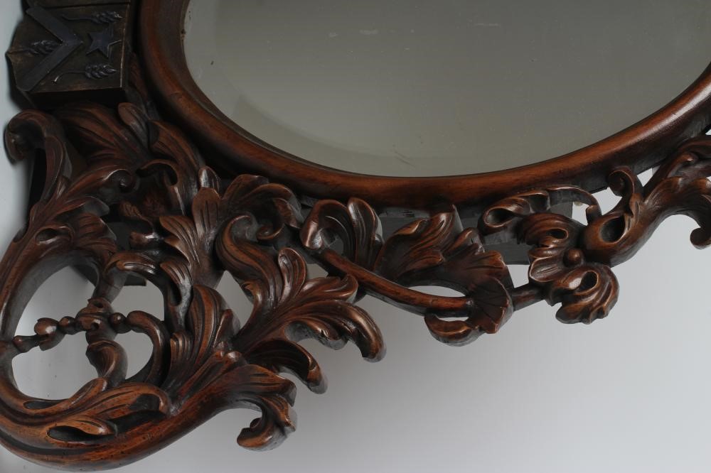A MAHOGANY FRAMED WALL MIRROR Image