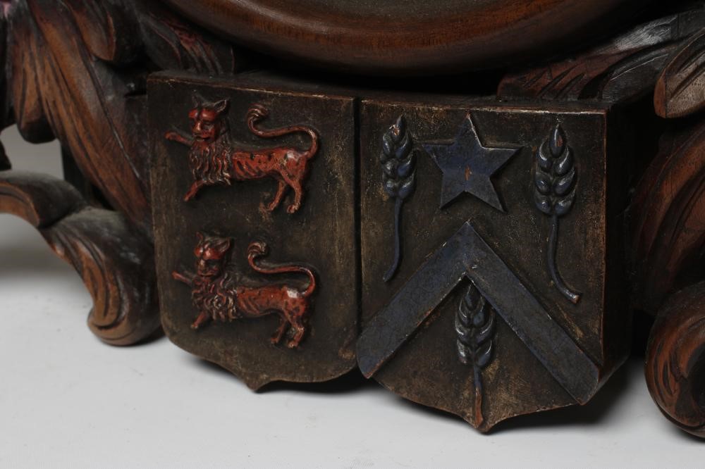 A MAHOGANY FRAMED WALL MIRROR Image