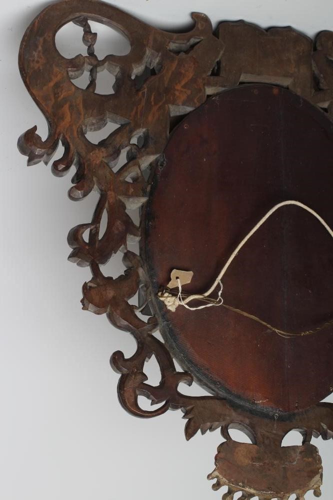 A MAHOGANY FRAMED WALL MIRROR Image