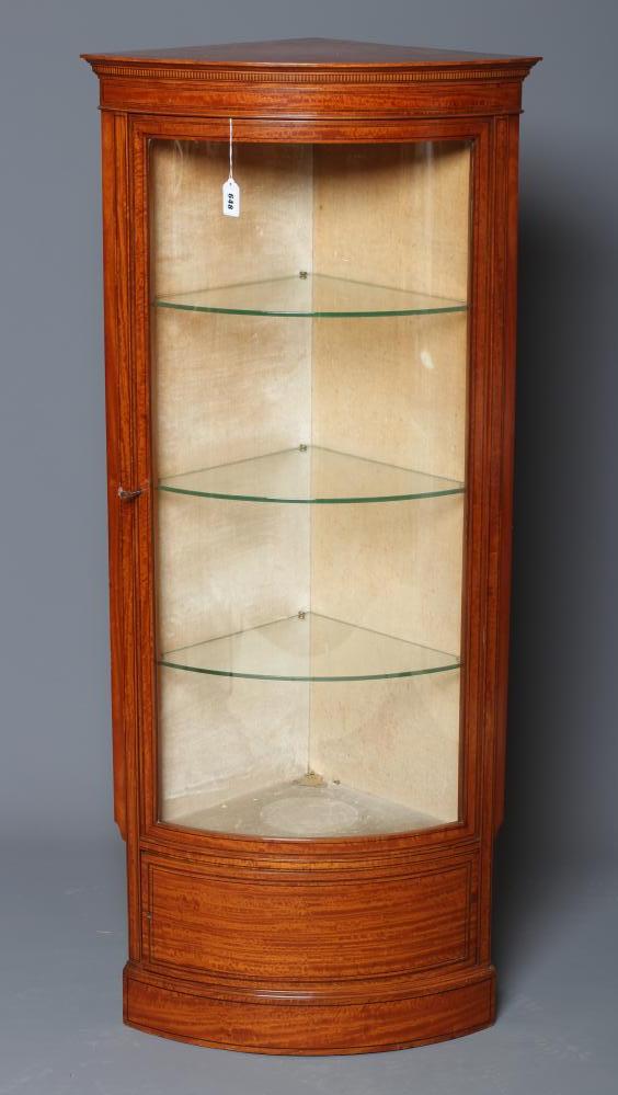 AN EDWARDIAN SATINWOOD SMALL CORNER CUPBOARD of concave form crossbanded with stringing Image