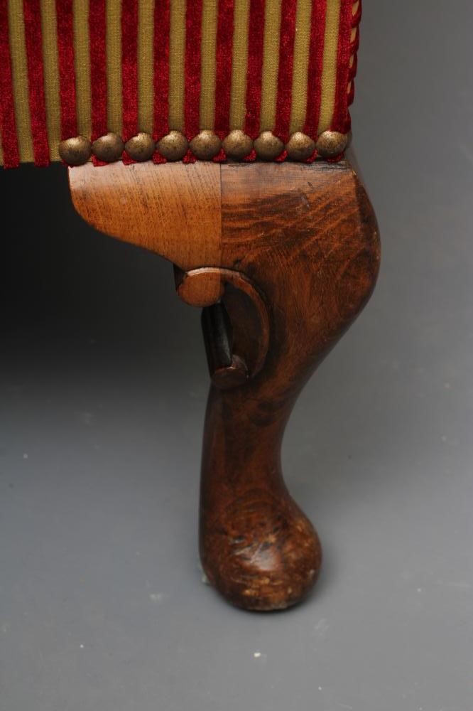 A GEORGIAN STYLE WINGED BACK ARMCHAIR in stained beech upholstered in Rubelli red and gold velvet Image