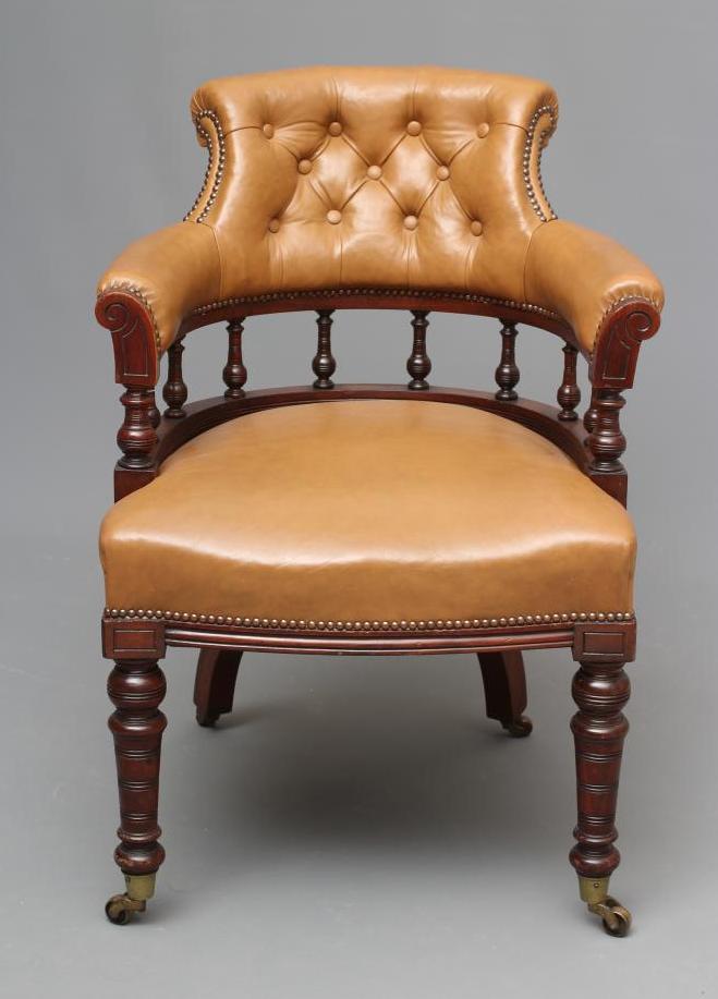A VICTORIAN WALNUT TUB OFFICE CHAIR button upholstered in tan leather Image