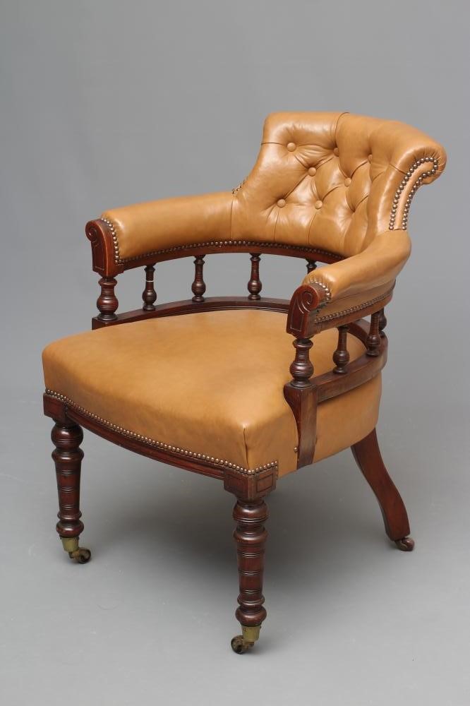 A VICTORIAN WALNUT TUB OFFICE CHAIR button upholstered in tan leather Image