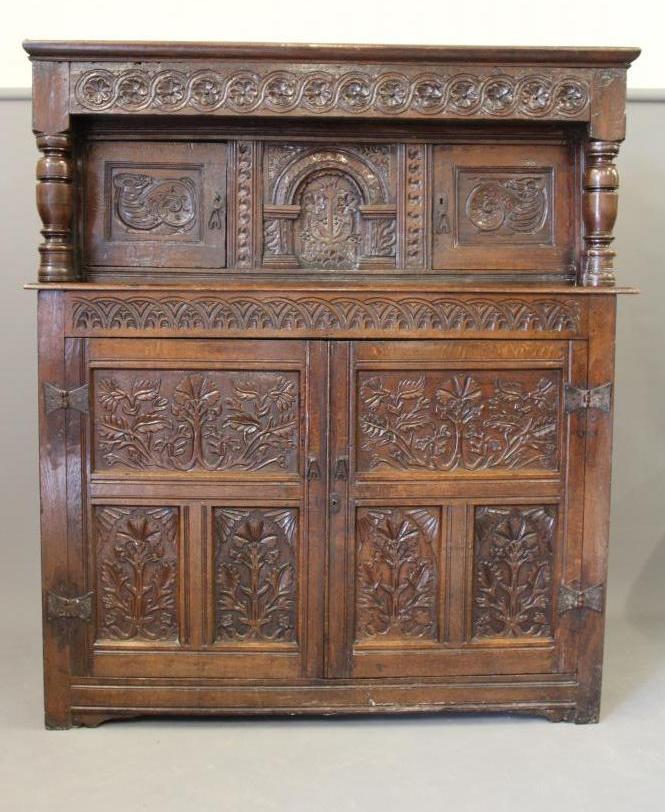 A CARVED JOINED OAK PRESS CUPBOARD Image