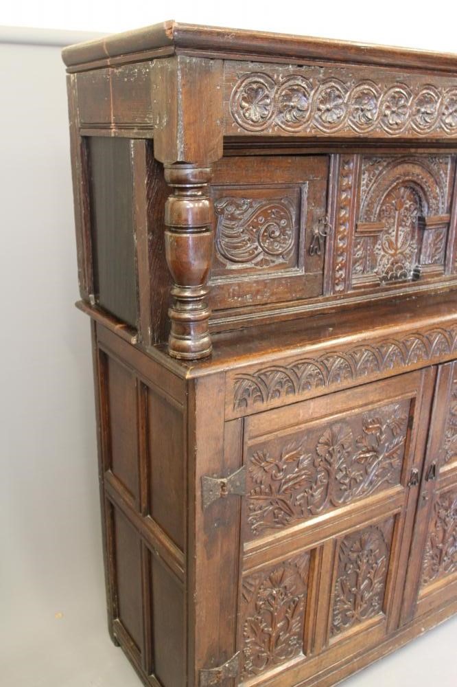 A CARVED JOINED OAK PRESS CUPBOARD Image