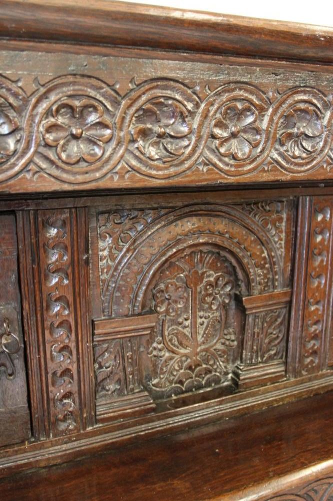 A CARVED JOINED OAK PRESS CUPBOARD Image