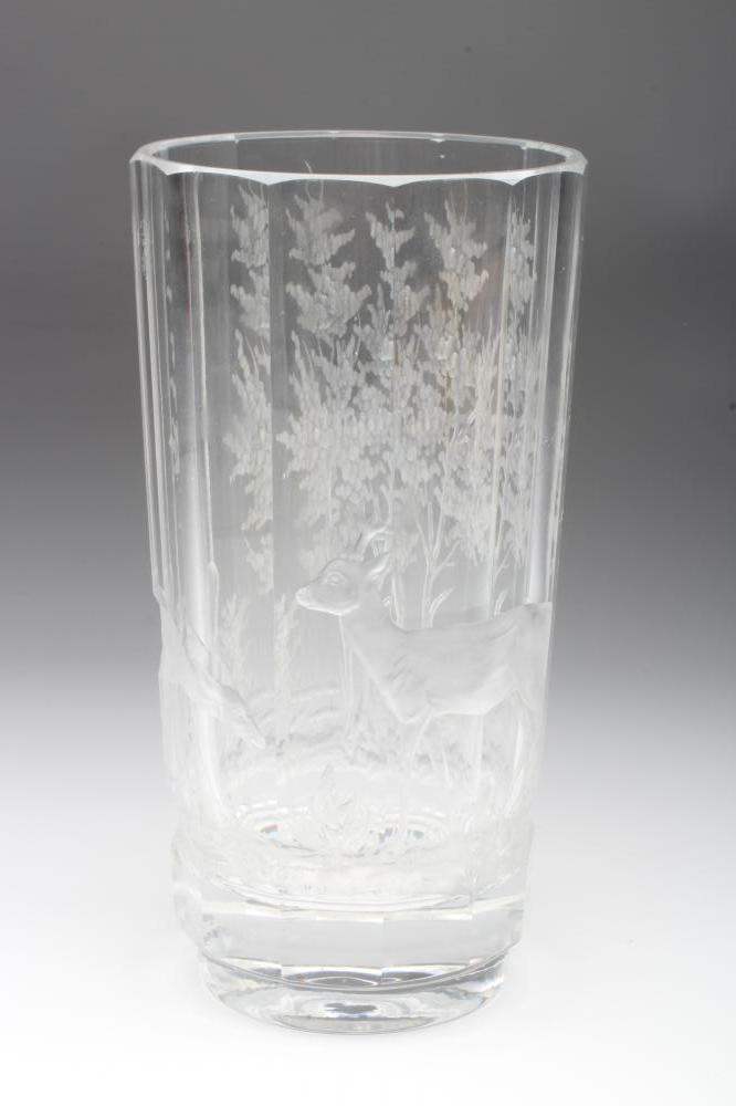 A PANELLED CYLINDRICAL GLASS VASE Image