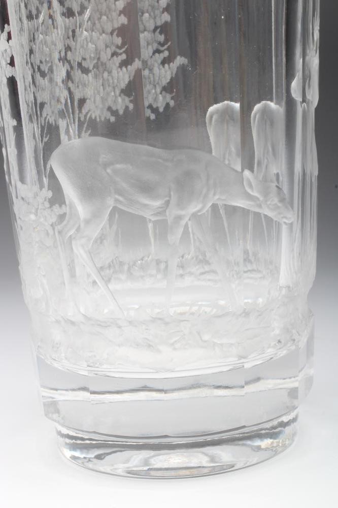 A PANELLED CYLINDRICAL GLASS VASE Image