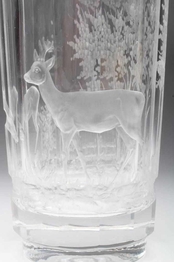 A PANELLED CYLINDRICAL GLASS VASE Image