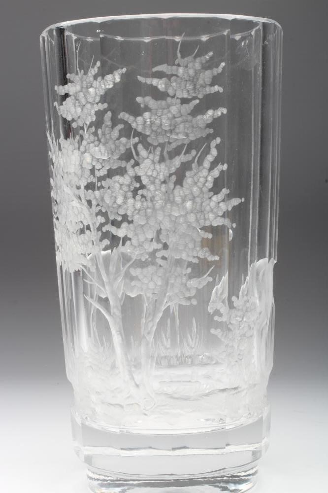 A PANELLED CYLINDRICAL GLASS VASE Image
