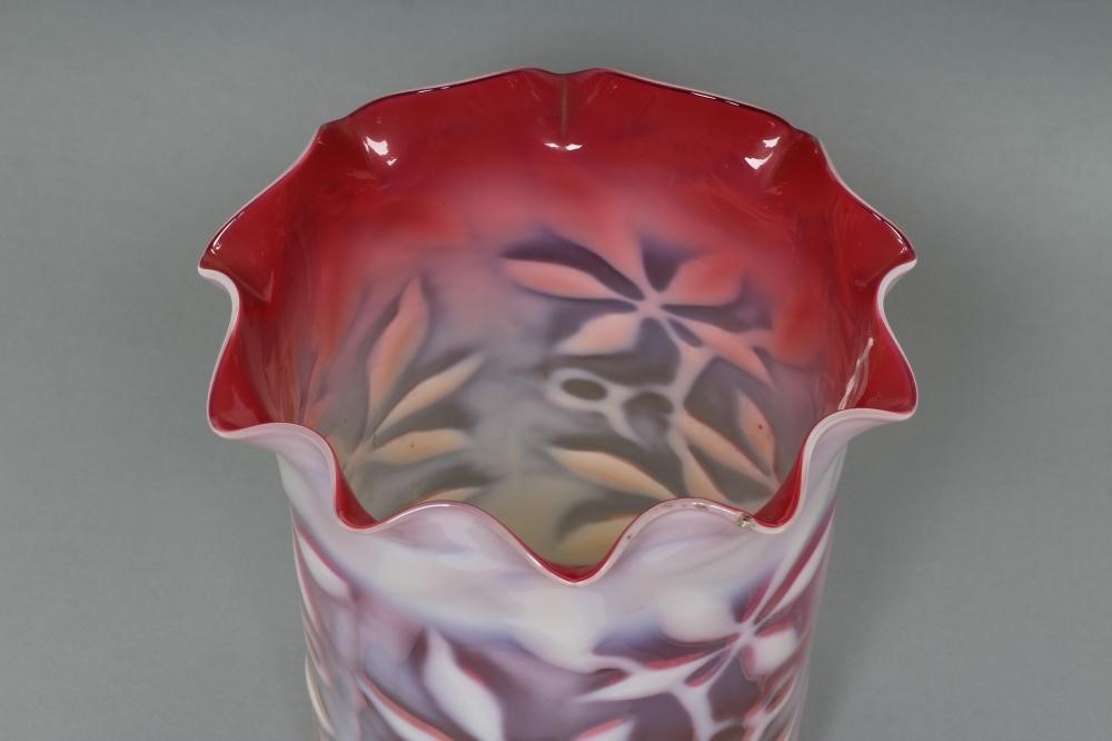A LATE VICTORIAN SHADED CRANBERRY GLASS SHADE of cylindrical form with frilled rim and white opaque Image