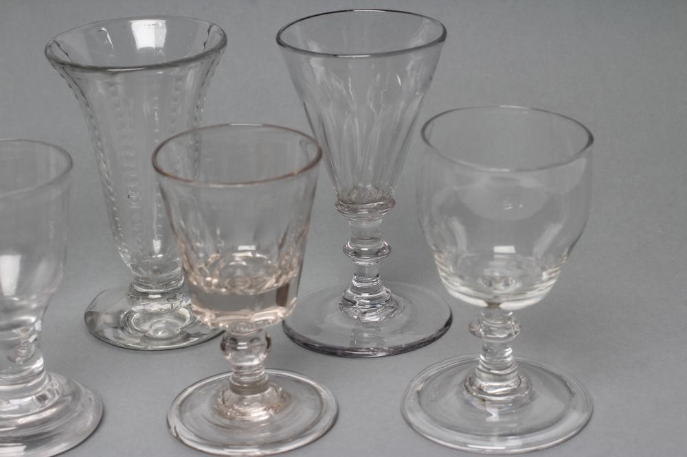 A COLLECTION OF NINE GEORGIAN AND LATER GLASSES including a cordial glass with facet cut stem Image