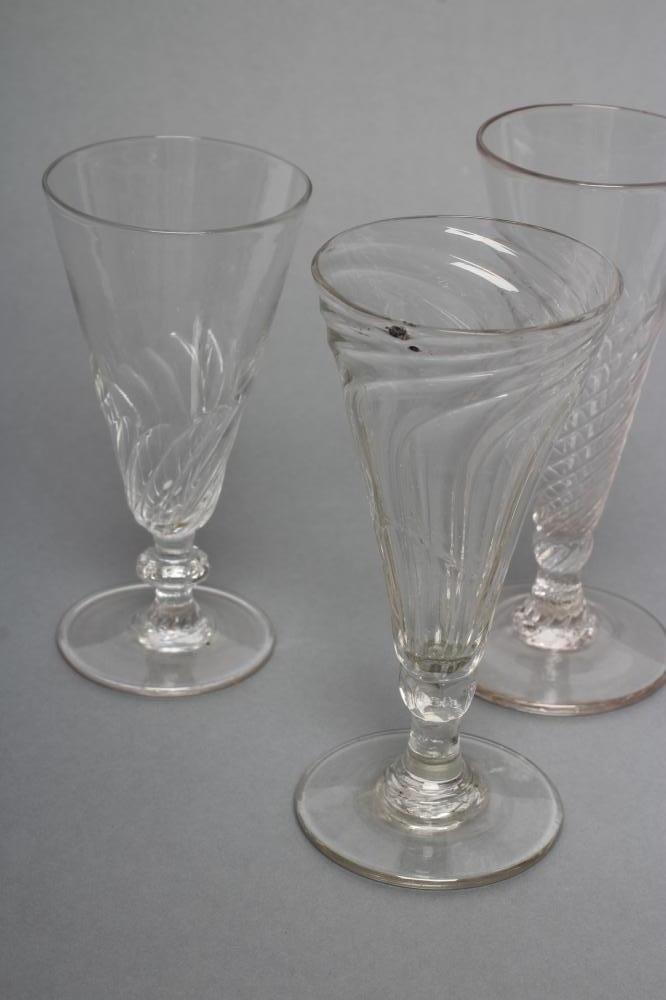 TWO SIMILAR DWARF GLASS ALE FLUTES Image