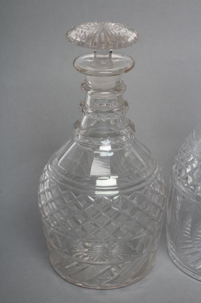 TWO VICTORIAN GLASS TRIPLE RING NECK MALLET DECANTERS AND STOPPERS with panelled shoulders and Image