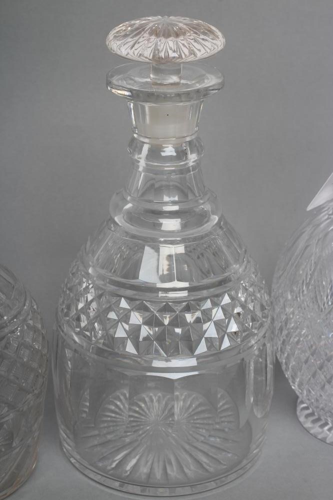 TWO VICTORIAN GLASS TRIPLE RING NECK MALLET DECANTERS AND STOPPERS with panelled shoulders and Image