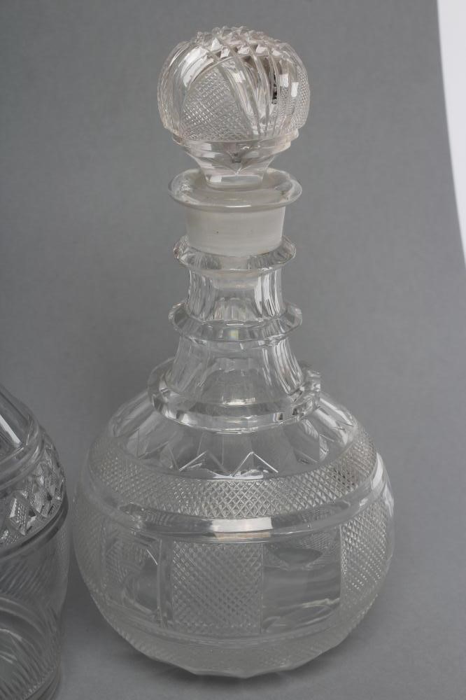 TWO VICTORIAN GLASS TRIPLE RING NECK MALLET DECANTERS AND STOPPERS with panelled shoulders and Image