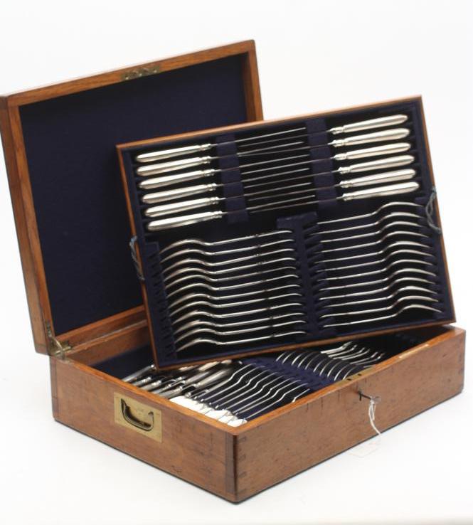 A TABLE SERVICE FOR TWELVE PLACE SETTINGS Image